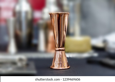 Copper Jigger For Cocktails Is On The Bar.