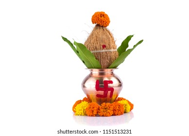 Copper Kalash with coconut and mango leaf with floral decoration on a white background. essential in hindu puja. - Powered by Shutterstock