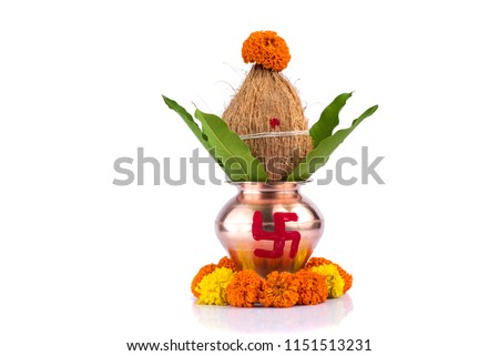 Copper Kalash with coconut and mango leaf with floral decoration on a white background. essential in hindu puja.