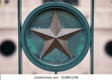 A Copper And Metal Star Of Texas Decorates Iron Fencing On The Texas State Capitol Grounds In Austin.