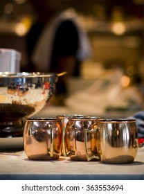 Copper Moscow Mule Cups On A Marble Counter Top.  