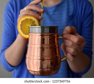 Copper Mug In The Hands