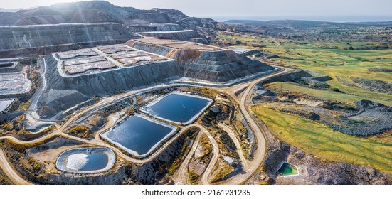 Copper ore solvent extraction at Skouriotissa mine in Cyprus. Leaching heaps and storage reservoirs  - Shutterstock ID 2161231235