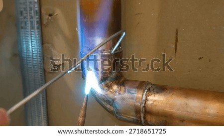 Copper pipe welding process with lead done by operators