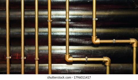 Copper Pipes And Fittings For Plumbing, On A Dark Wooden Background