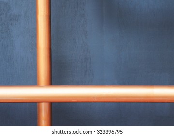 Copper Pipes Installed On Black Wall