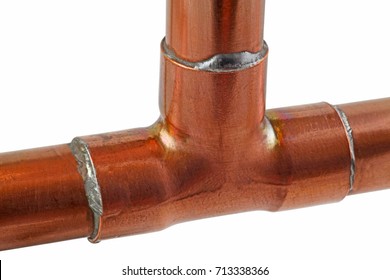 Copper pipework –  Three sections of copper pipes connected  to an end feed copper tee isolated on a white background, 