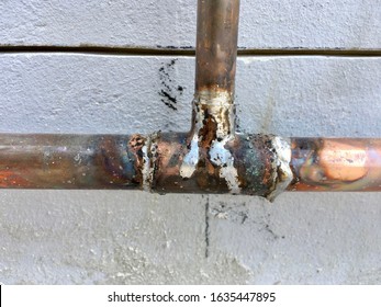 Copper Plumbing Pipe Soldered And Plumed To Bring Water Into A Building. 