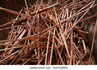 Copper scrap, copper pipes, recycling water lines and other pipes in the house, windings without insulation. Hanover, Germany. - Shutterstock ID 2167506435
