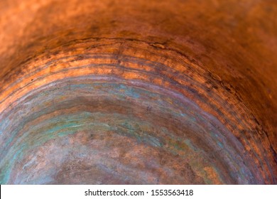 Copper surface of the inner part of the copper pot. Oxidation of copper. Copy space.
