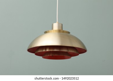 Copper tin lamp, hanging on electric wire. Hanging lamp at home.
