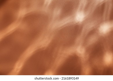 Copper Water Ripples Background -  Underwater Texture. Sun Shining Through Water.