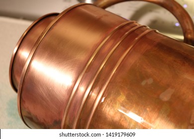 A Copper Watering Can That Had Irregular Tarnish Removed And A Layer Of Wax Applied Afterward.