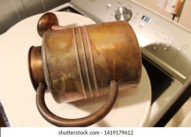 A Copper Watering Can That Had Irregular Tarnish Removed And A Layer Of Wax Applied Afterward.