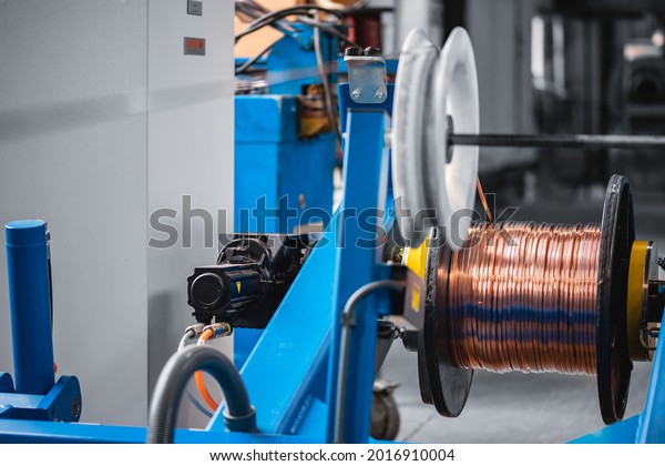 Copper wire cable production in coils, metal steel\
industrial plant.