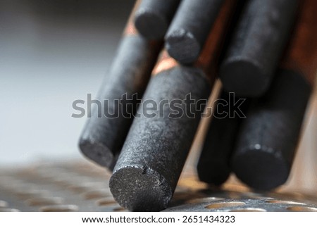 Copper-plated carbon electrode, bundle of rods made from rare earth materials