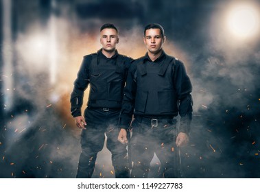 Cops In Black Uniform And Body Armor