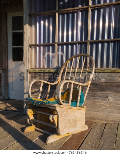 a copy\
of an antique rocking chair in a ghost\
town