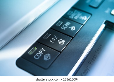 Copy and fax button on a copy machine with blue lights
