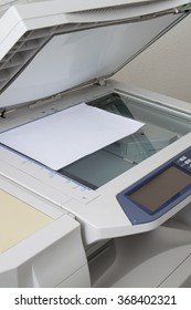 Copy Machine And Paper Isolated On A White Background