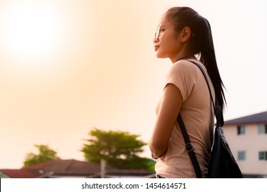 Copy space. Asian girl wearing glasses optical filter. And standing in outdoors with look forward during the daylight. - Shutterstock ID 1454614571