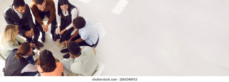 Copy Space Banner Background With Diverse Team Sitting In Circle And Talking. Psychologist Providing Professional Guidance In Group Therapy. High Angle View From Above People In Room With Light Floor