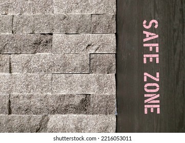 Copy Space Brick Wall With Sign SAFE ZONE On The Wood, Means Places Where People Can Feel Safe - Free Of Bias, Conflict, Criticism Or Discrimination, No Emotional Or Physical Harm