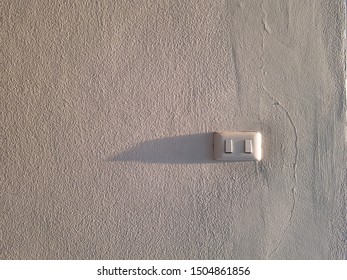 copy space light switch on white wall.