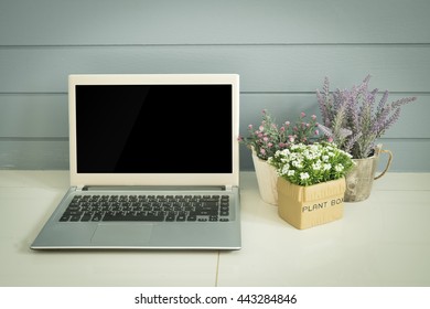 copy space screen with notebook and flower pot. View from front with notebook space.