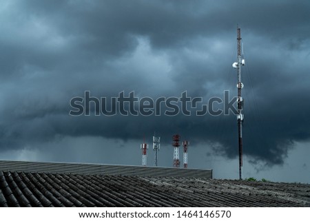 Copy space. Signal transmission pole on the day of severe storm with dark clouds.