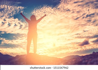 Copy space of silhouette woman raise hand up on top of mountain and sunset sky abstract background. Freedom and travel adventure concept. Vintage tone filter effect color style. - Shutterstock ID 1511547962
