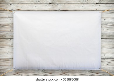 Copy Space For Text On Disastrously White Vinyl Banner On Wood Background .Clipping Path