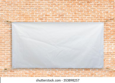 Copy Space For Text On Disastrously White Vinyl Banner On Brick Background .Clipping Path