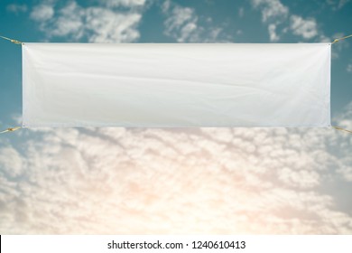 Copy space for text on long white vinyl banner on Blue sky background 