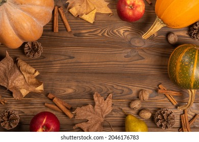 copy space,pumpkin decor, wooden background, composition for a photo, cinnamon, leaves, background for an inscription, background for a presentation,
