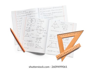 Copybook with handwritten maths formulas, pencil and rulers isolated on white background