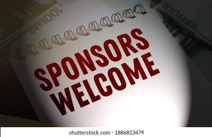 Copybook With SPONSORS WELCOMED Text Written Put On Some 100 Euro Banknotes On The Table. Croudfunding Fundraising Sponsorship Donation Business Startup Concept.