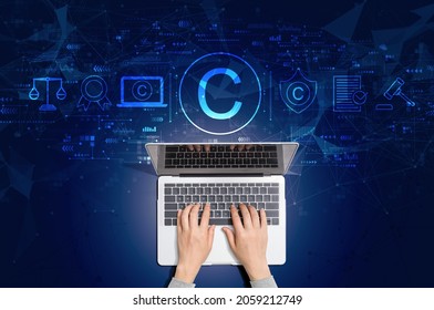 Copyright concept with person using a laptop computer