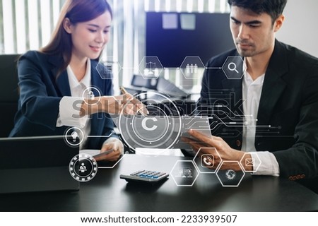 Copyright or patent concept, Business team analyzing data and using smart phone and tablet with virtual screen copyright icon trademark license, Creation ownership against piracy. at office
