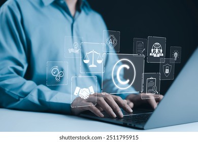 Copyright or patent concept. Businessman working on a laptop with digital icons representing intellectual property and digital copyright law. Trademark license, copyleft, Rights symbol, Piracy crime,