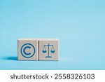 Copyright or patent concept. Copyright icon on wooden block for author rights and patent intellectual property