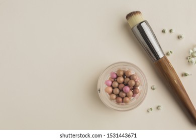 Copy-space with blush and brush on table