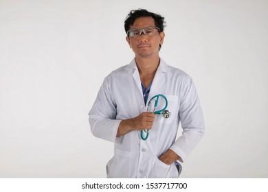 copyspace isolated on white background medical doctor holding​ng stethoscope and Stand​ing​ confidence in clinical Hospital research Healthcare