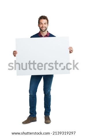 Copyspace for your customization. Studio portrait of a handsome man holding a blank placard against a white background.