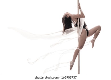 Copy-spaced image of a young pole dance woman over a white background