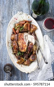 Coq Au Vin With Vegetable In Burgundy Sauce As Top View On A Plate