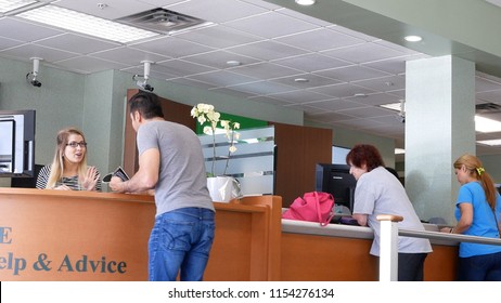 Coquitlam, BC, Canada - May 14, 2018 : Motion of people talking to the teler at service counter inside TD bank