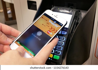Coquitlam, BC, Canada - May 24, 2018 : Motion Of Man Using Apple Pay To Pay Foods At Mcdonalds Restaurant