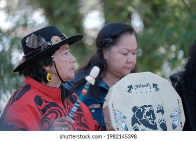 Coquitlam, BC, Canada - May 29, 2021: Local Indigenous Elder Plays Their Drum At The 