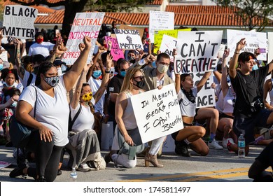 Coral Gables, Florida - May 30, 2020: Protesters Kneeling Peacefully During Protest For George Floyd